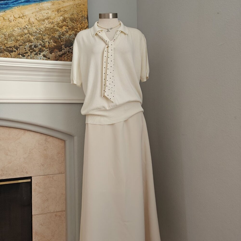 Cream knit top with attached polka-dot tie detail